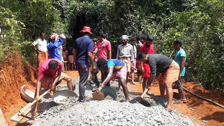 Concrete being laid on the road to Posalige